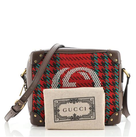 gucci trunk purse.